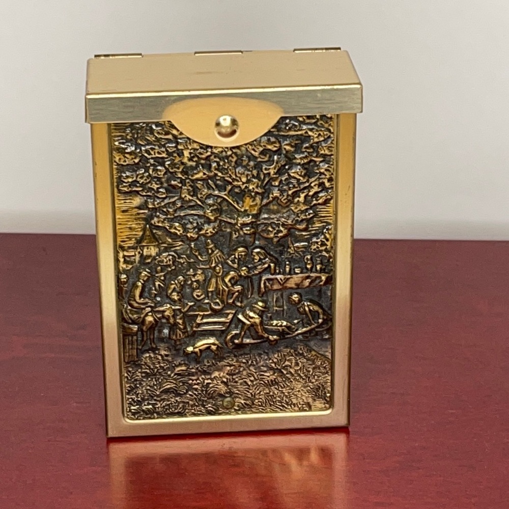 Vintage metal tobacco box with relief art